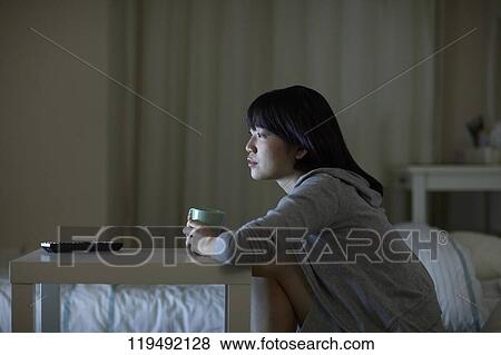 Stock Photo - Young Japanese woman in her house. Fotosearch