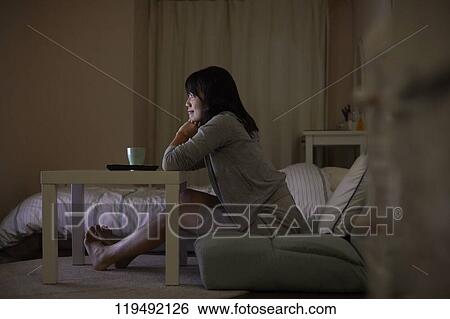 Young Japanese woman in her house View Large Photo Image Stock Photograph - Young Japanese woman in her house. Fotosearch