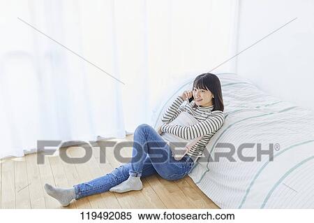 Young Japanese woman in her house View Large Photo Image Stock Photography - Young Japanese woman in her house. Fotosearch