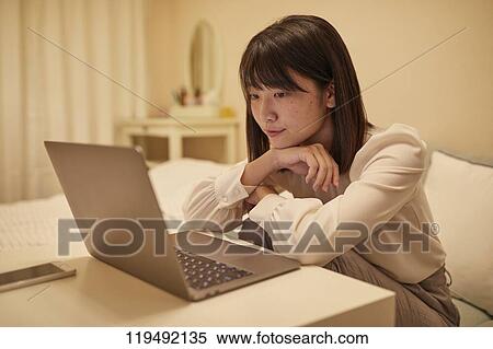 Young Japanese woman in her house View Large Photo Image Stock Photography - Young Japanese woman in her house. Fotosearch