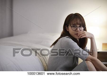 Young Japanese woman in the bedroom View Large Photo Image Stock Image - Young Japanese woman in the bedroom. Fotosearch