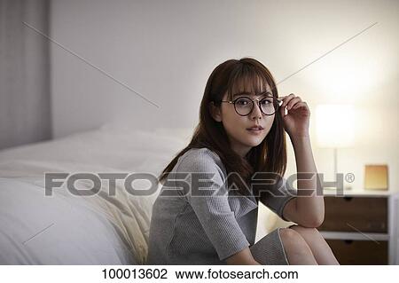 Young Japanese woman in the bedroom View Large Photo Image Stock Image - Young Japanese woman in the bedroom. Fotosearch