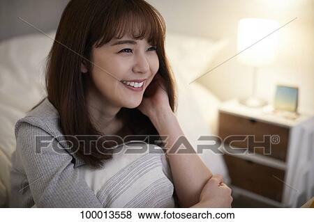 Young Japanese woman in the bedroom View Large Photo Image Stock Photo - Young Japanese woman in the bedroom. Fotosearch