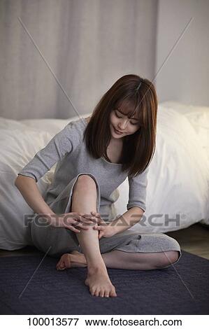 Young Japanese woman in the bedroom View Large Photo Image Stock Photo - Young Japanese woman in the bedroom. Fotosearch