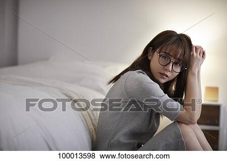 Young Japanese woman in the bedroom View Large Photo Image Stock Photo - Young Japanese woman in the bedroom. Fotosearch