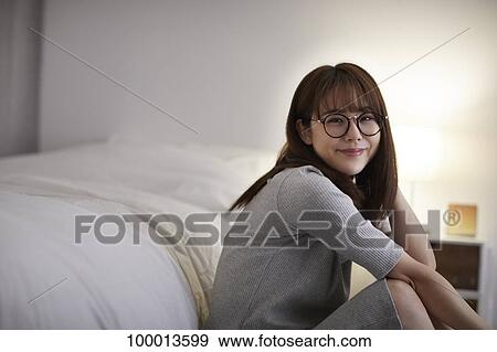 Young Japanese woman in the bedroom View Large Photo Image Stock Photo - Young Japanese woman in the bedroom. Fotosearch