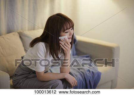 Young Japanese woman in the living room View Large Photo Image Stock Image - Young Japanese woman in the living room. Fotosearch