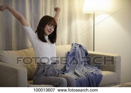 Young Japanese woman in the living room View Large Photo Image Stock Photo - Young Japanese woman in the living room. Fotosearch
