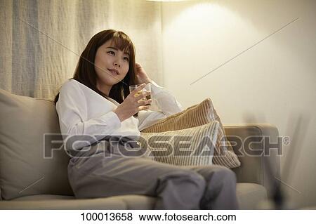Young Japanese woman in the living room View Large Photo Image Stock Photo - Young Japanese woman in the living room. Fotosearch