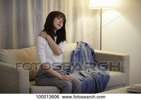 Young Japanese woman in the living room View Large Photo Image Stock Photograph - Young Japanese woman in the living room. Fotosearch