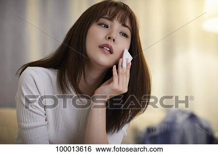 Young Japanese woman in the living room View Large Photo Image Stock Photograph - Young Japanese woman in the living room. Fotosearch