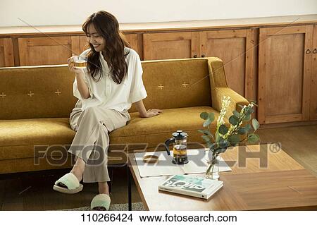 Young Japanese woman on the sofa View Large Photo Image Picture - Young Japanese woman on the sofa. Fotosearch