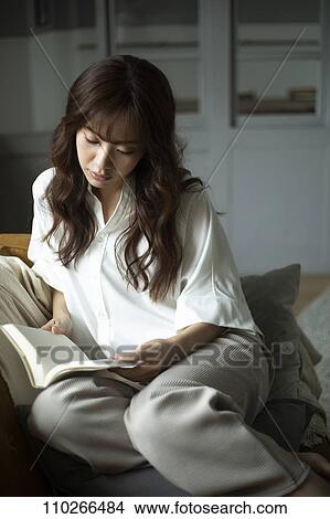 Young Japanese woman on the sofa View Large Photo Image Picture - Young Japanese woman on the sofa. Fotosearch