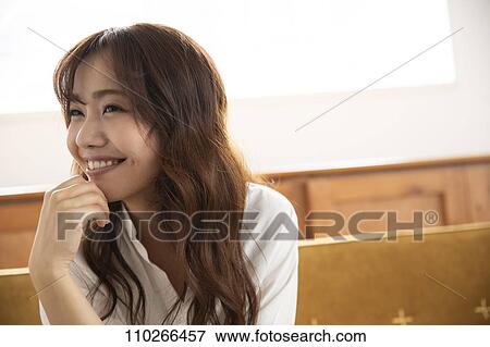 Young Japanese woman on the sofa View Large Photo Image Stock Photo - Young Japanese woman on the sofa. Fotosearch