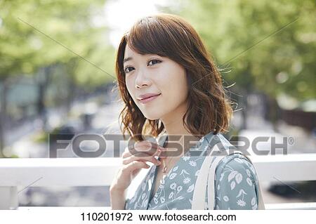 Young Japanese woman portrait View Large Photo Image Stock Image - Young Japanese woman portrait. Fotosearch