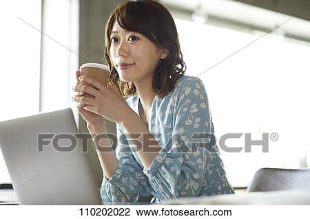 Stock Image - Young Japanese woman portrait. Fotosearch