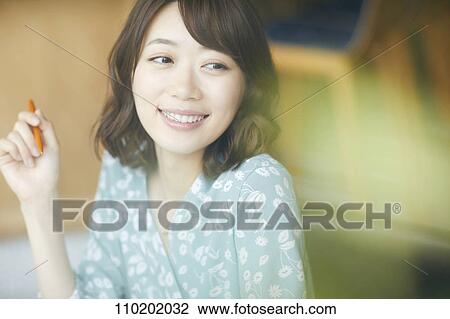 Stock Image - Young Japanese woman portrait. Fotosearch