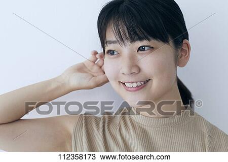 Stock Image - Young Japanese woman portrait. Fotosearch