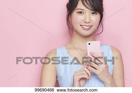 Young Japanese woman portrait View Large Photo Image Stock Photograph - Young Japanese woman portrait. Fotosearch