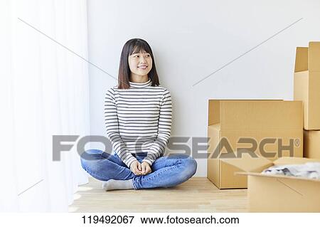 Young Japanese woman relocating View Large Photo Image Stock Photo - Young Japanese woman relocating. Fotosearch