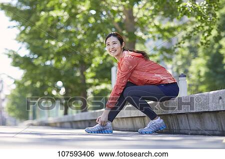 Young Japanese woman running downtown Tokyo View Large Photo Image Stock Photograph - Young Japanese woman running downtown Tokyo. Fotosearch