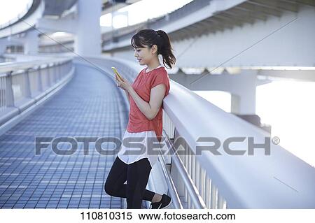 Young Japanese woman running downtown Tokyo View Large Photo Image Stock Photography - Young Japanese woman running downtown Tokyo. Fotosearch