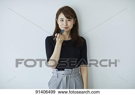 Young Japanese woman View Large Photo Image Stock Photo - Young Japanese woman. Fotosearch