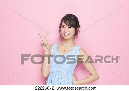 Stock Image - Young Japanese woman studio portrait. Fotosearch