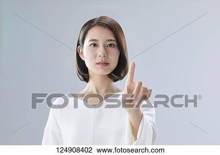 Young Japanese woman studio portrait View Large Photo Image Stock Image - Young Japanese woman studio portrait. Fotosearch