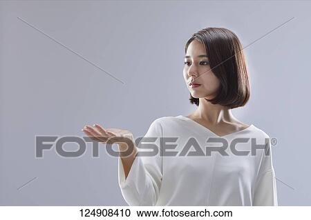 Stock Image - Young Japanese woman studio portrait. Fotosearch
