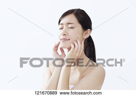 Stock Photo - Young Japanese woman studio portrait. Fotosearch