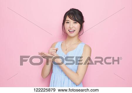 Young Japanese woman studio portrait View Large Photo Image Stock Photo - Young Japanese woman studio portrait. Fotosearch