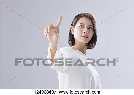 Stock Photo - Young Japanese woman studio portrait. Fotosearch