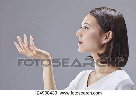 Stock Photo - Young Japanese woman studio portrait. Fotosearch