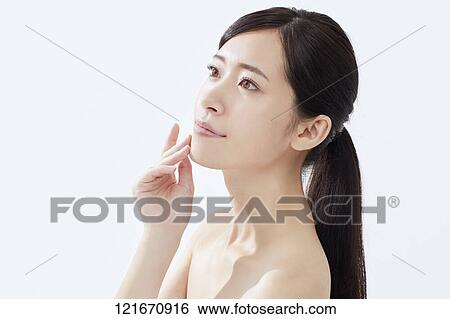 Stock Photograph - Young Japanese woman studio portrait. Fotosearch