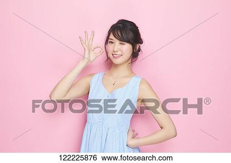 Stock Photograph - Young Japanese woman studio portrait. Fotosearch