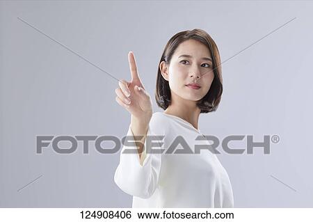 Young Japanese woman studio portrait View Large Photo Image Stock Photograph - Young Japanese woman studio portrait. Fotosearch