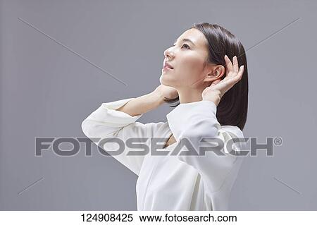 Young Japanese woman studio portrait View Large Photo Image Stock Photography - Young Japanese woman studio portrait. Fotosearch