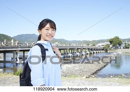 Picture - Young Japanese woman traveling in Kyoto. Fotosearch