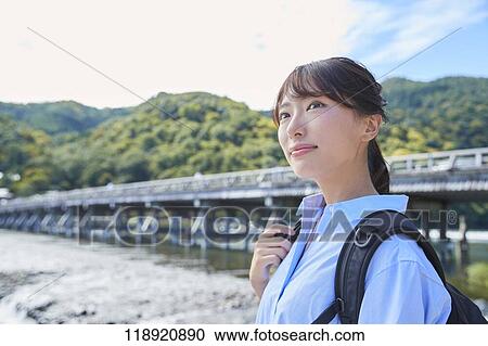 Young Japanese woman traveling in Kyoto View Large Photo Image Stock Image - Young Japanese woman traveling in Kyoto. Fotosearch