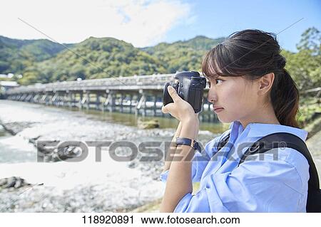 Young Japanese woman traveling in Kyoto View Large Photo Image Stock Image - Young Japanese woman traveling in Kyoto. Fotosearch