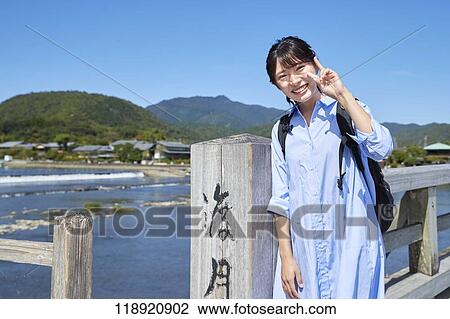 Young Japanese woman traveling in Kyoto View Large Photo Image Stock Image - Young Japanese woman traveling in Kyoto. Fotosearch