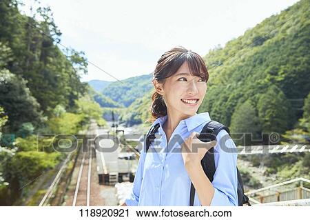 Young Japanese woman traveling in Kyoto View Large Photo Image Stock Image - Young Japanese woman traveling in Kyoto. Fotosearch
