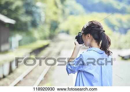 Young Japanese woman traveling in Kyoto View Large Photo Image Stock Image - Young Japanese woman traveling in Kyoto. Fotosearch