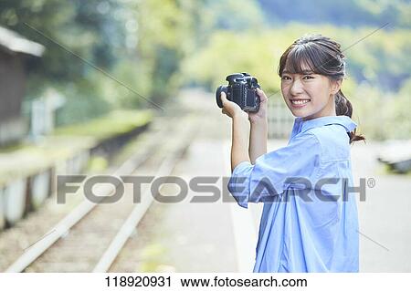 Young Japanese woman traveling in Kyoto View Large Photo Image Stock Image - Young Japanese woman traveling in Kyoto. Fotosearch