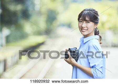 Young Japanese woman traveling in Kyoto View Large Photo Image Stock Image - Young Japanese woman traveling in Kyoto. Fotosearch