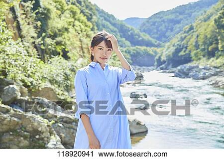 Stock Image - Young Japanese woman traveling in Kyoto. Fotosearch