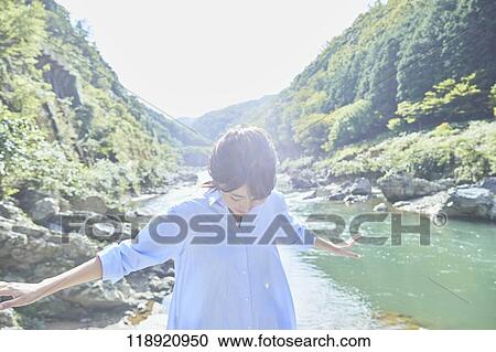 Stock Image - Young Japanese woman traveling in Kyoto. Fotosearch