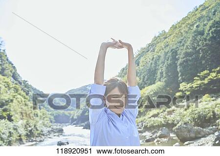 Stock Image - Young Japanese woman traveling in Kyoto. Fotosearch