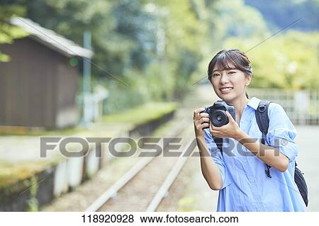 Stock Photo - Young Japanese woman traveling in Kyoto. Fotosearch